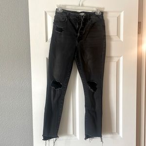 Distressed black high rise skinny jeans from Good American